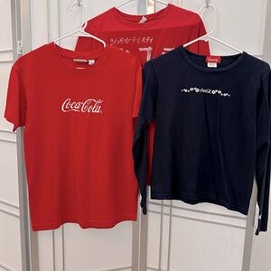 Set of three Coca Cola women’s shirts. Sizes M-L.  Good condition!